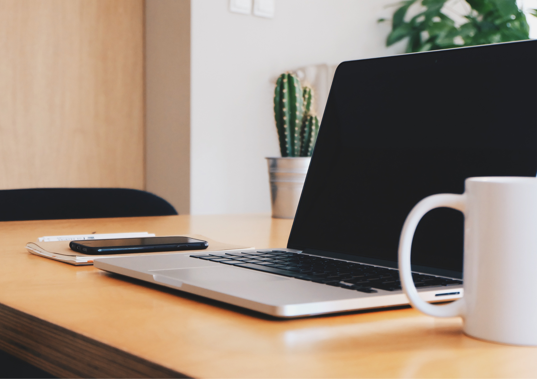 Sleek, minimalist office table with a cup of coffee